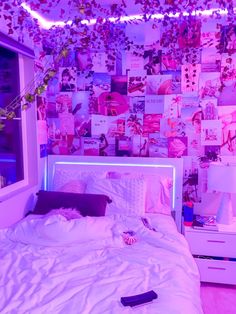 a bed with white sheets and pillows in front of a pink wallpapered bedroom