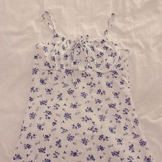 This Adorable White Dress With Purple Flowers Has Never Been Worn And Comes In The Original Bag From Shein. Ties In The Front And Zipper In The Back. 26.5 Inches Long. Size Small, But Fits Like X-Small. Comes In The Original Bag, No Flaws. White Cotton Mini Dress With Ditsy Floral Print, Casual White Mini Dress With Ditsy Floral Print, White Printed Cotton Mini Dress, Purple Floral Dress, Shein Dress, Shein Dresses, Original Bags, Purple Floral, Purple Flowers