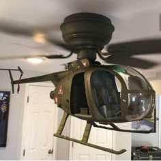 a helicopter mounted to the ceiling in a room