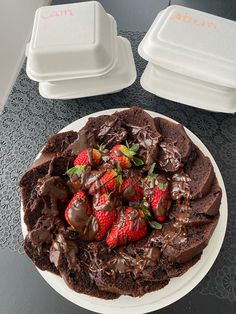 a chocolate cake with strawberries on top