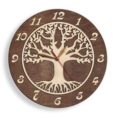 a wooden clock with an image of a tree in the center and numbers around it