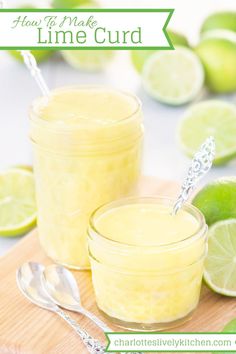 two jars filled with lime curd sitting on top of a cutting board