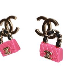 These funky Chanel earrings feature a dangling pink resin classic quilted flap bag with a black leather and gold tone handle on a signature gold tone CC pierced ear clip. Collection: 23SOrigin: Italy Condition: New and never wornAccompanied by: Chanel boxMeasurements: 1.5" width x 1" height Y2k Princess, Cc Earrings, Lil Black Dress, Chanel Pink, Pierced Ear, Chanel Brand, Classic Flap Bag, Pink Chanel, Chanel Earrings