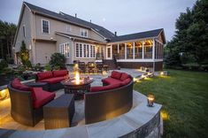 an outdoor patio with fire pit and seating