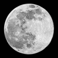 the full moon is shown in black and white