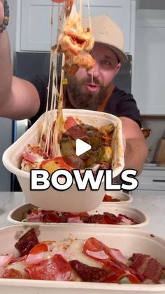 a man is holding up some food in his hands and the words bowlls are above him