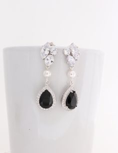 "Luxury Black and White Bridal Pearl Earrings with Genuine Swarovski Teardrop Crystals for your Wedding! Sterling Silver Earrings feature sparkly Black Swarovski drops that hang from Rhodium plated and Sterling post earrings with clear Cubic Zirconia Drops and white Swarovski Pearls. They are perfect for a wedding or any other special occasion. They are gorgeous as focal point of your outfit. Also great for Bridesmaids sets. Contact me for larger orders. These earrings have been made with CRYSTA Teardrop Clip-on Jewelry For Wedding, Pear-shaped Clip-on Wedding Earrings, Pear-shaped Clip-on Earrings For Wedding, Wedding Pear-shaped Clip-on Jewelry, Pear-shaped Clip-on Wedding Jewelry, Black Dangle Chandelier Earrings For Wedding, Black Crystal Earrings For Wedding, Mother Of The Groom Jewelry, Mother Of The Bride Jewelry