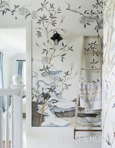 a white room with a ladder and wallpaper on the walls in front of it