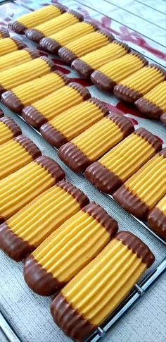 chocolate covered cookies lined up in rows on a baking sheet, ready to go into the oven