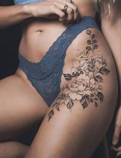 a woman's stomach with flowers on it