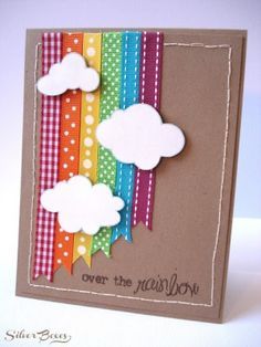 a handmade card with clouds and rainbows on the side, saying over the rainbow