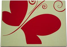 a red and white painting with swirls on it's back side, in the shape of a butterfly