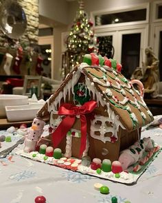 a gingerbread house is decorated for christmas