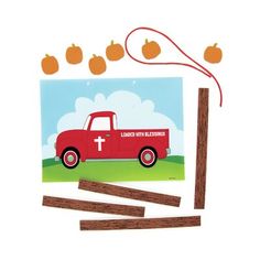 an image of a red truck with pumpkins on the roof and clothes pins attached to it