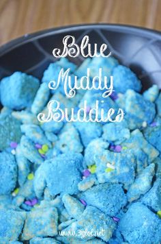 blue muddy buddies in a black bowl with sprinkles on the side and text overlay that reads, blue muddy buddies