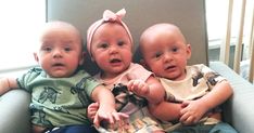 three babies sitting next to each other on a couch