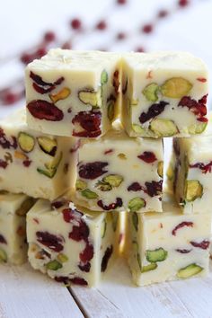 orange cranberry pistachio fudge is stacked on top of each other