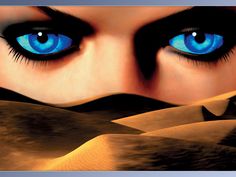 a woman's face with blue eyes surrounded by sand dunes and desert like terrain