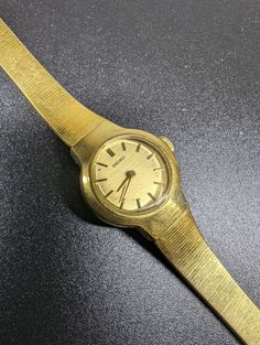 SEIKO Ladie's Watch 1980's, gold plated watch, mechanical, Japan. The watch is used, in good condition, there are no big signs of wear, the watch runs, but is behind by 20 minutes per day. Vintage Gold Analog Watch, Gold Vintage Analog Watches, Retro Gold Analog Watch Accessories, Vintage Gold Watches With Metal Dial, Retro Gold Watch Accessories With Round Dial, Gold Retro Watch With Round Dial, Gold Retro Watch Accessories, Seiko Watches Women, Gold Plated Watch