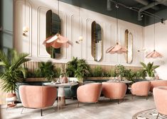 the interior of a restaurant with pink chairs and tables, potted plants and mirrors on the wall