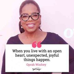 opal winfrey holding up a sign that says when you live with an open heart, unexpected, joyful things happen