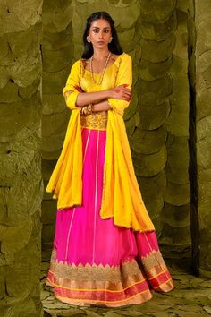 Shocking pink lehenga skirt with silk tape, woven border, aari gold zari beaten hand embroidery, beads work, zardozi, sequins, and gota patti, with floral embroidered dandelion yellow broad waistband. Comes with embroidered dandelion yellow blouse and dupatta. - Aza Fashions Transitional Pink Dress With Cutdana, Transitional Pink Raw Silk Lehenga, Transitional Pink Silk Lehenga, Transitional Season Pink Silk Lehenga, Transitional Pink Lehenga With Cutdana, Transitional Silk Choli In Pink, Transitional Pink Raw Silk Choli, Transitional Pink Silk Dresses, Shocking Pink Lehenga