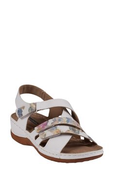 Mixed textures and crisscrossing vamp straps create visual intrigue on a weekend-ready sandal grounded by a cushioned footbed and durable rubber sole. 1/2" platform Adjustable ankle strap with hook-and-loop closure Memory foam cushioning with arch support Synthetic upper and lining/rubber sole Imported White Round Toe Slingback Sandals With Arch Support, White Slingback Sandals With Arch Support And Round Toe, White Slingback Sandals With Arch Support, White Slingback Sandals With Strap, White Slingback Strap Sandals, White Open Toe Slingback Sandals With Arch Support, Synthetic Sandals With Adjustable Cross Strap, White Synthetic Slingback Sandals With Adjustable Strap, White Leather Cross Strap Sandals