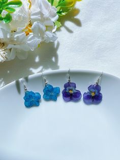 Welcome to GeminiAngieShop! More colors are coming! All my items are light, usually no shipping fees for additional items. All items are handmade in USA and in a pet / smoke free environment. Real pressed flower earrings are made with hypoallergenic hooks, real dried flowers dangle. Each pair comes with rubber earrings. Item's color might vary from monitor to monitor. The earrings are handmade by me, size might be a little different. They are perfect gifts for girls and adults. I have more handmade earrings and gifts in my store, please check it. Tracking Included with every order Blue Flower-shaped Resin Earrings, Resin Earrings With Flower Charm For Gift, Resin Flower Earrings With Ear Wire As Gift, Resin Flower Earrings With Ear Wire For Gift, Resin Flower Earrings Gift, Hypoallergenic Resin Flower Earrings, Purple Pressed Flower Earrings For Gift, Purple Pressed Flower Earrings Gift, Blue Flower Earrings For Mother's Day