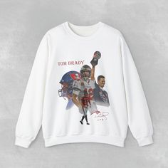 Introducing the Tom Brady Custom Bootleg Crewneck Sweatshirt, a must-have for any New England Patriots fan. This NFL sweatshirt features a unique bootleg design that sets it apart from the rest. Made from high-quality materials, it offers both comfort and style. Show your love for Tom Brady and the Patriots with this one-of-a-kind sweatshirt. Perfect as a gift or to add to your own collection, this Patriots sweatshirt is sure to be a game-changer. Get yours today and represent your favorite NFL Fan Apparel Crew Neck Sweatshirt With Sublimation Print, Fan Apparel Sweatshirt With Sublimation Print, Crew Neck Sweatshirt With Sublimation Print For Fan Merchandise, Bootleg Design, Nfl Sweatshirt, Patriots Fans, Tom Brady, Nfl Teams, New England Patriots