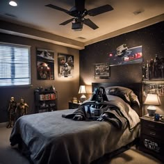 a star wars themed bedroom with darth vader poster on the wall and lights