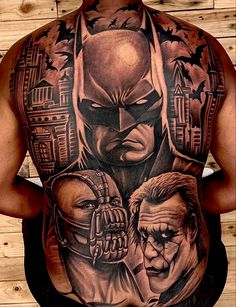 the back of a man with batman tattoos