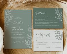 the wedding stationery is displayed on top of a wood slice with greenery and calligraphy