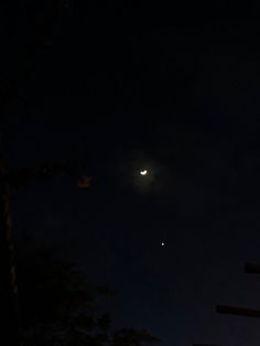 the moon and venus are visible in the night sky