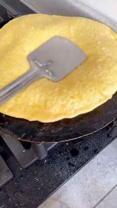 an omelette is being cooked on the stove