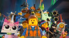 an iphone with the lego movie on it's screen and various characters in front