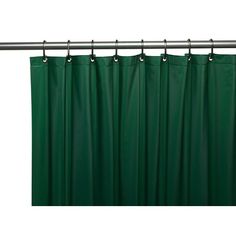 a green curtain hanging on a metal rod