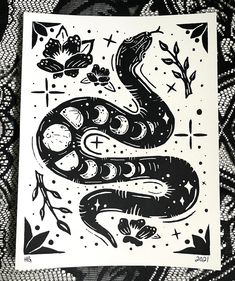 a black and white drawing of a snake with flowers on it's back ground