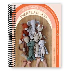 a spiral notebook with crochet animals on it and the title mama made minis knotted love's