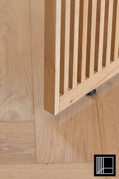 a close up of a wooden floor with the bottom part of it showing wood slats