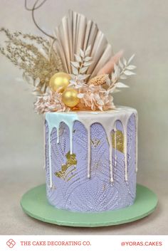 a cake decorated with icing and gold decorations