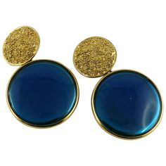 YVES SAINT LAURENT vintage massive dangling earrings (clip-on) featuring a textured gold toned top and blue resin disc. Embossed YSL Made in France. Indicative measurements : height approx. 8.2 cm (3.23 inches) / max. diameter approx. 5 cm (1.97 inches). NOTES - This is a preloved vintage item, therefore it might have imperfections. - Colors may differ slightly from actual product appearance due to differences in lighting conditions. - As a buyer, you are fully responsible for customs duties, ot Ysl Vintage, Blue Disc, Saint Laurent Vintage, St Laurent, Turquoise Earrings Dangle, Disc Earrings, Ruby Earrings, Vintage Jewels, Dangling Earrings