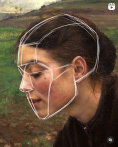 a woman's face is shown with lines drawn on it to form the shape of a mask