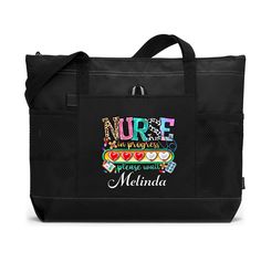 Celebrate the journey of becoming a nurse with our Personalized "Nurse in Progress" Tote Bag with Mesh Pockets, the perfect gift for student nurses. Crafted with aspiring nurses in mind, this tote bag serves as a symbol of dedication and passion for the nursing profession.  Key Features:  1. **Customizable Personalization Make this tote bag uniquely yours by adding your name or a special message. The personalized touch adds a meaningful connection to your journey as a student nurse.  2. **Practi Nurse Tools, Teacher Tote, Zipper Tote Bag, Zippered Tote, Personalized Embroidered, Personalized Prints, Nursing Students, Student Gifts