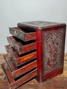 an old wooden box with many drawers