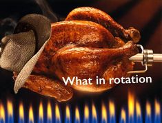 a roasting turkey with a cowboy hat on it's head and flames in the background