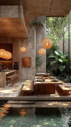 the inside of a modern house with pool and outdoor dining area in the foreground