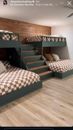 there are three bunk beds with checkered sheets on the bottom and second bed below