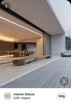 a wooden bench sitting on top of a hard wood floor next to a swimming pool