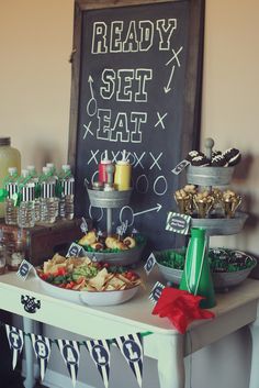 a party table with food and decorations on it