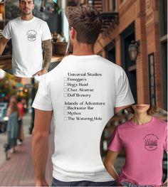 a man and woman walking down the street wearing t - shirts that say universal studies